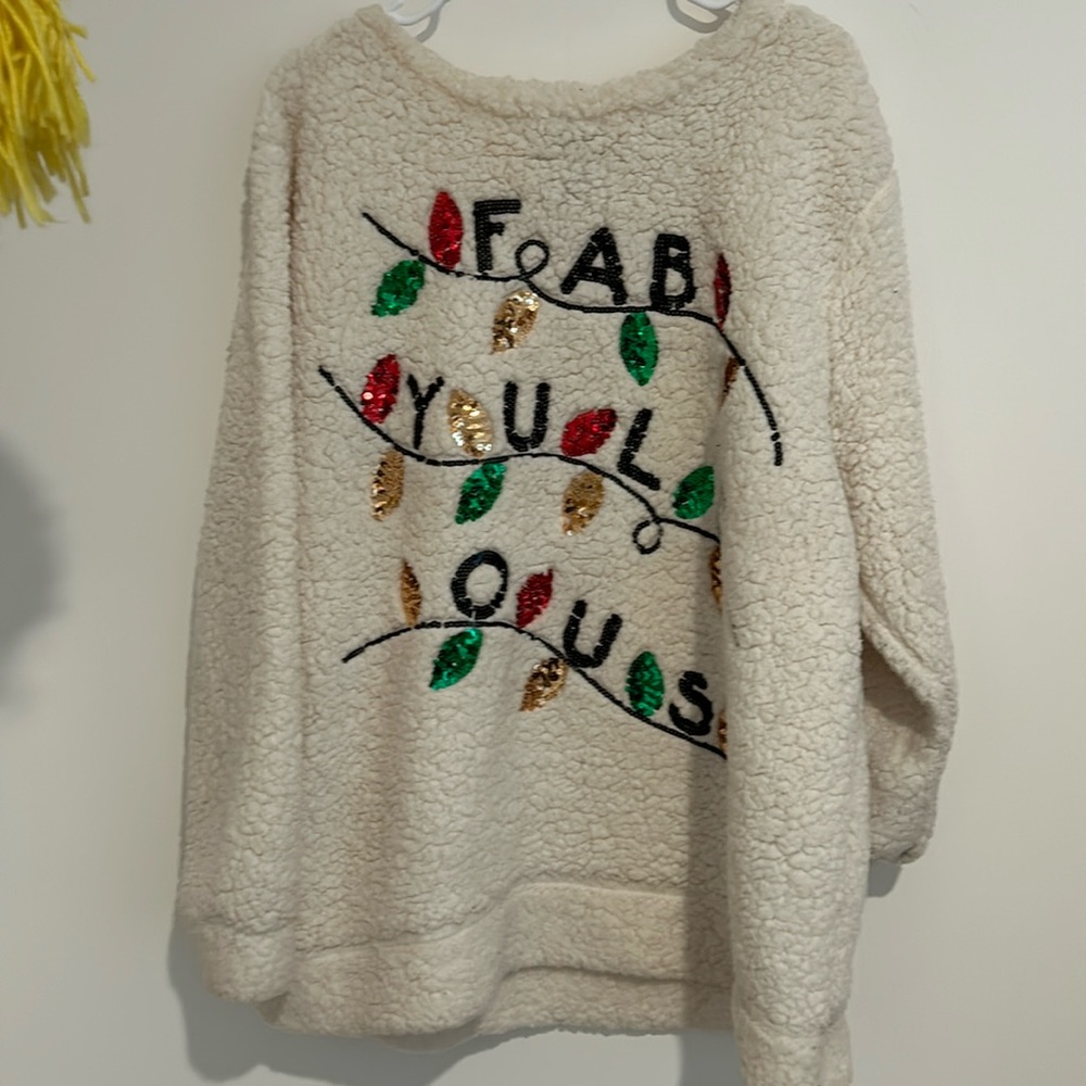 MissChevious holiday sweater says “FAB-YULE-OUS” red, green and yellow leaves